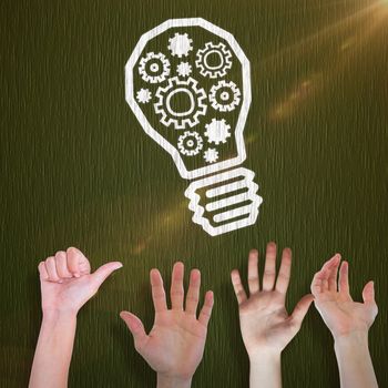 Cropped hand of man pretending to hold invisible object against green