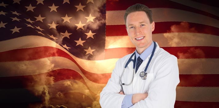 Doctor standing arms crossed on white background against composite image of digitally generated united states national flag