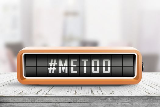 Metoo hashtag message on a retro alarm device in a bright room on a table