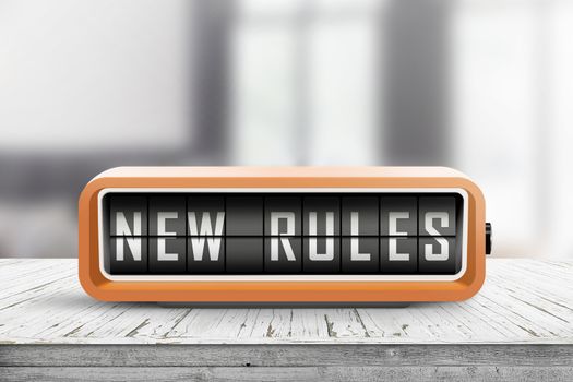 New rules alarm message on a wooden desk in a bright indoor environment