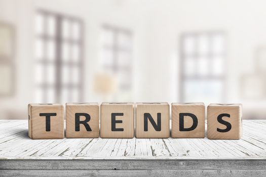 Trends sign in a bright home on a wooden desk with white paint