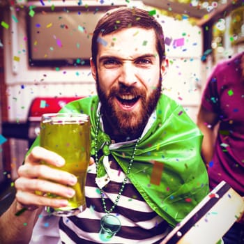 Flying colours against disguised man holding green pint 3d