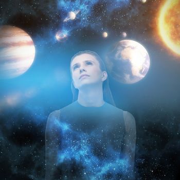 Sad woman looking up against graphic image of various planets with sun 3d