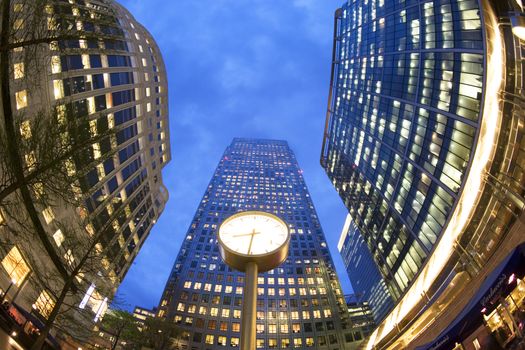Low angle with a fish eye lens of office buildings at dusk