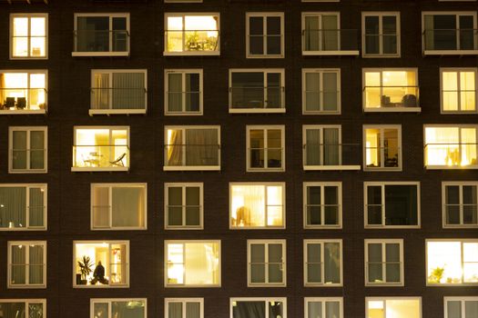 Modern apartment building at dusk