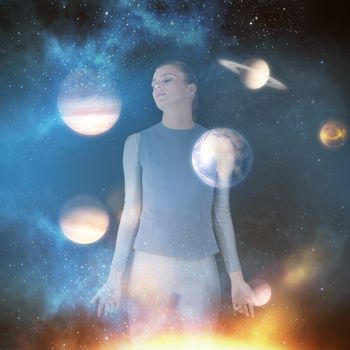 Beautiful woman meditating against composite image of planets over sun 3d