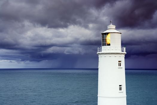 Lighthouse against a stormy sky.