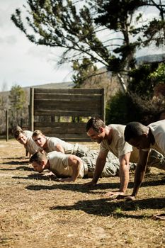 Soldiers performing pushup exercise in boot camp