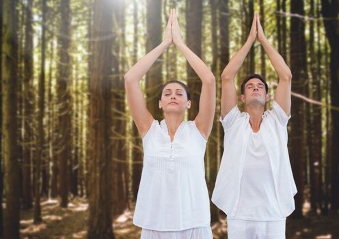 Digital composite of People Meditating yoga in forest