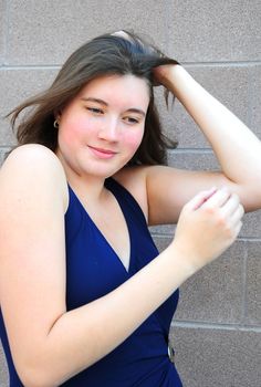 Female beauty expressions wearing a swimsuit outside.