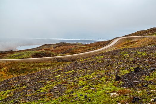 Mountains and ocean view in Borgarfjordur Eystri in east Iceland in a foggy day