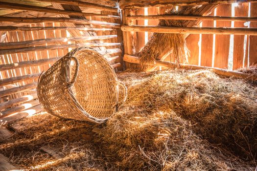 Sun shining through a beautiful hay loft in an old barn