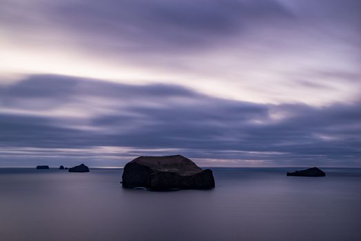 The coast and the ocean of Vestmannaeyjar island at sunset, Iceland