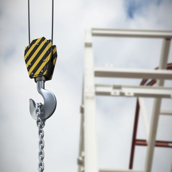 Studio Shoot of a crane lifting hook against low angle view of scaffolding against cloudy sky