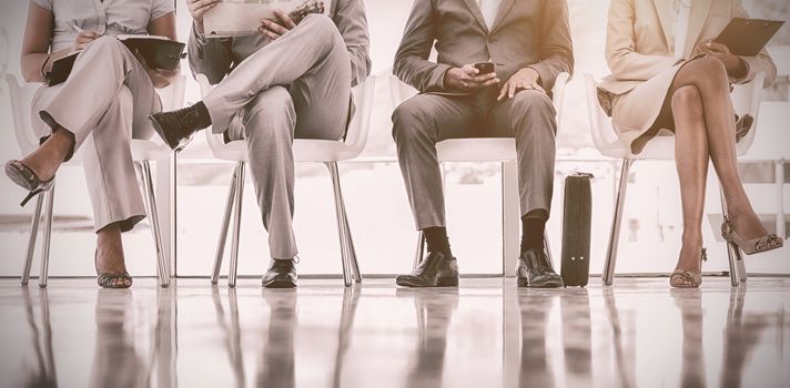 Low section of business people waiting in office