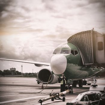 Airplane parked against sky on runway