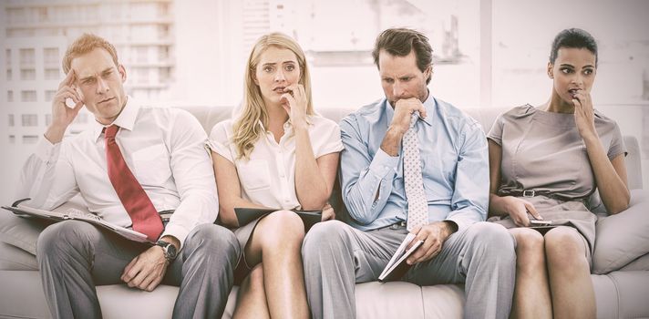 Nervous business people waiting for job interview