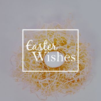 Easter greeting against white easter egg in nest