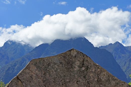 The sacred rock ("roca sagrada") was formed to resemble the Andes mountain peaks in the background.