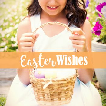 Happy girl collecting easter eggs against easter greeting
