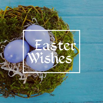 Easter greeting against violet easter eggs against blue wood background