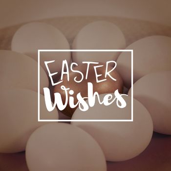 Easter greeting against white and golden easter eggs in plate