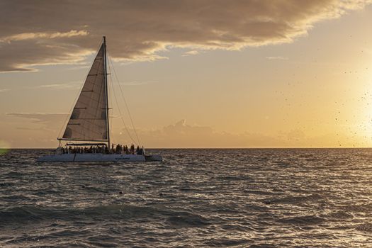 Catamaran on the sea at sunset in caribbean sea