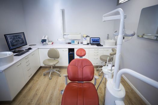Professional dentistry chair and dentist tools in clinic