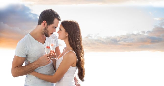 Digital composite of Romantic couple toasting champagne flutes against sky