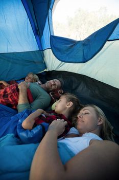 Family sleeping peacefully in the tent