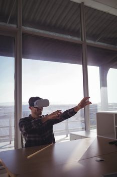 Businessman testing virtual reality technology at office