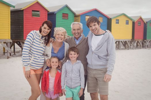 Portrait of multi-generation family standing at beach