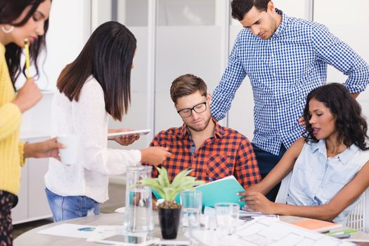 Business people at desk during meeting in office