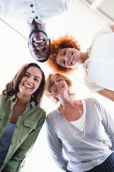 Directly below portrait of business people standing in office