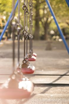 Red swing in the kindergarten of Asukayama park in the Kita district of Tokyo, Japan.