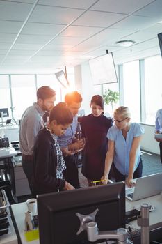 Business people concentrating while working together at office desk