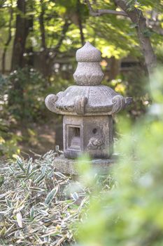 Stone lantern in the garden of Shibusawa Museum of Asukayama park in the Kita district of Tokyo, Japan.It is part of one of the three museums in Asukayama Park and was build in 1925.