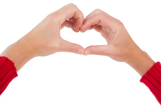 Woman making heart shape with hands on white background