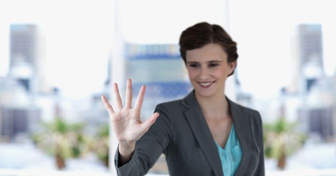 Digital composite of Happy businesswoman gesturing outdoors