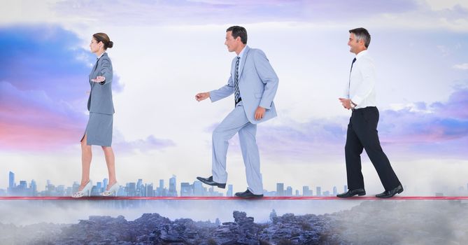 Digital composite of Business people walking on rope