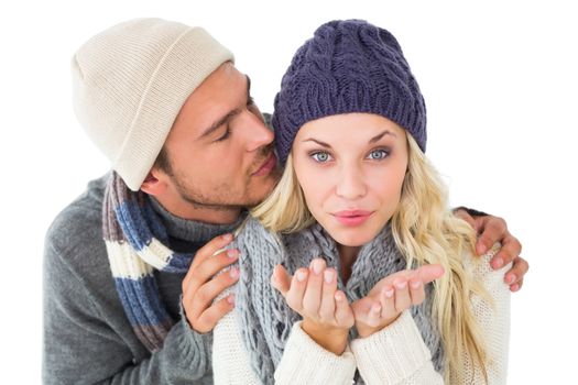 Attractive couple in winter fashion on white background