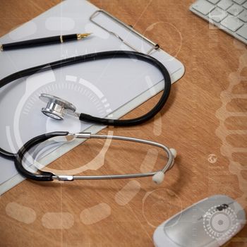 DNA illustration against black background against high angle view of stethoscope with clipboard by wireless keyboard and mouse 