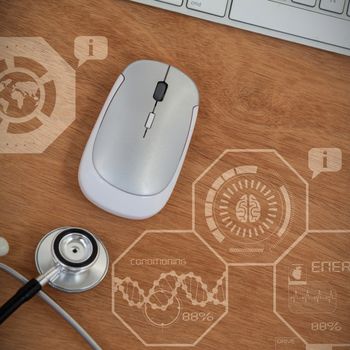 Digitally composite image of human fitness illustration against close up of wireless computer mouse and keyboard with stethoscope 