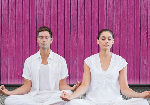 Digital composite of fitness yoga couple with pink wood background