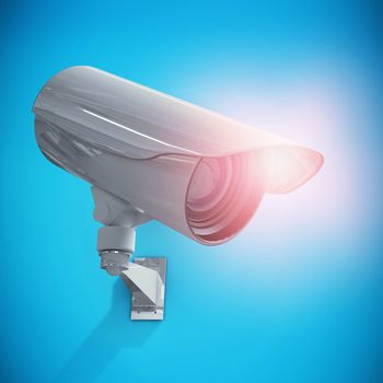 CCTV camera against blue background