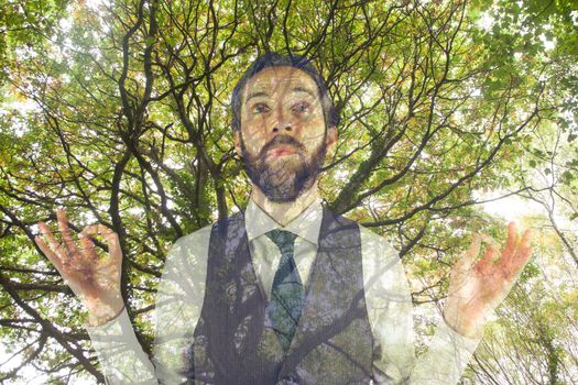 Digital composite of Man doing yoga under a tree