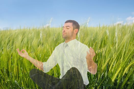 Digital composite of Man doing yoga in field of green sproutings