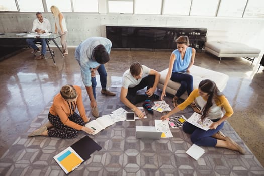 High angle view of business people planning in creative office