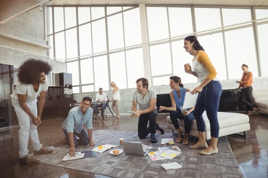 Smiling business people working in creative office