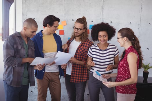 Group of business people having discussion in creative office